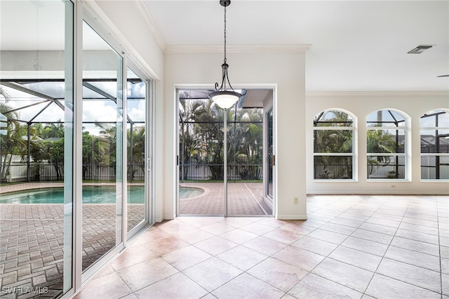 interior space with crown molding and light tile patterned floors