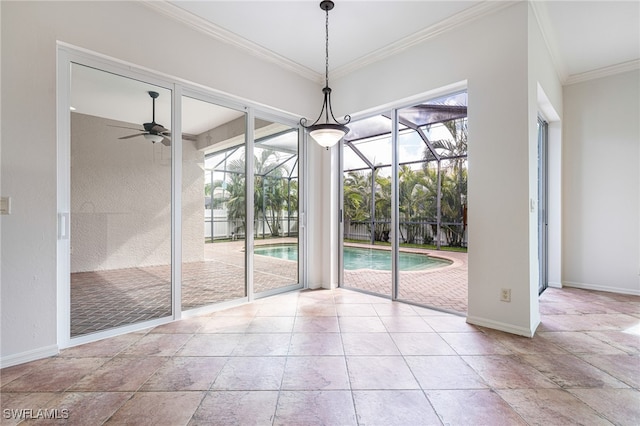 unfurnished dining area with a wealth of natural light, crown molding, and ceiling fan