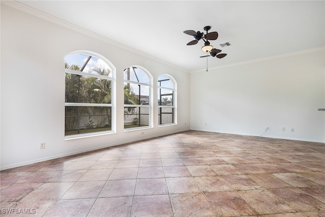 empty room featuring a healthy amount of sunlight, ceiling fan, and ornamental molding