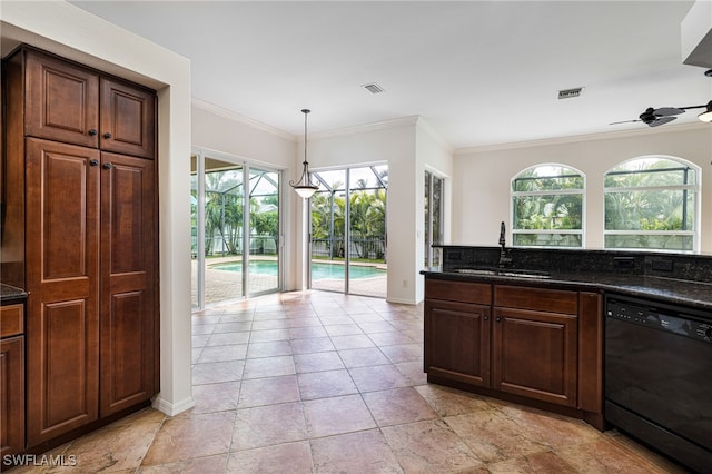 kitchen featuring a wealth of natural light, dishwasher, ceiling fan, and hanging light fixtures