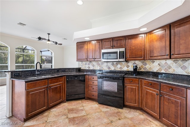 kitchen featuring dark stone countertops, black appliances, kitchen peninsula, tasteful backsplash, and ornamental molding