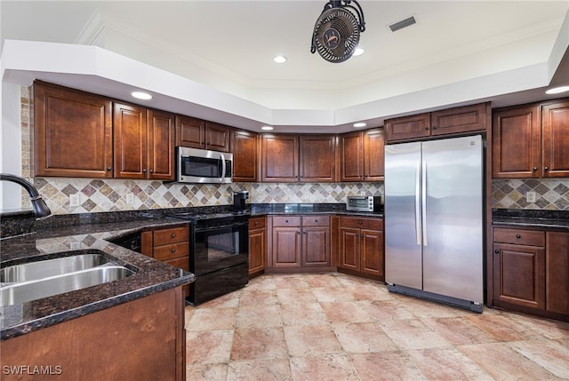 kitchen with crown molding, stainless steel appliances, sink, and decorative backsplash