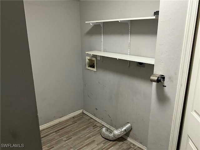 laundry area featuring washer hookup and hardwood / wood-style flooring