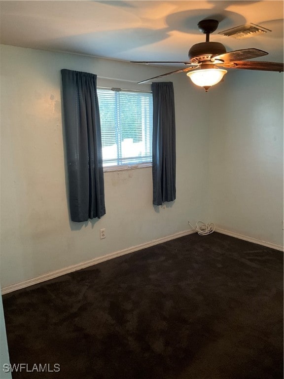 empty room featuring carpet flooring and ceiling fan