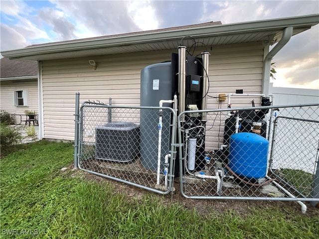 rear view of house featuring central AC unit