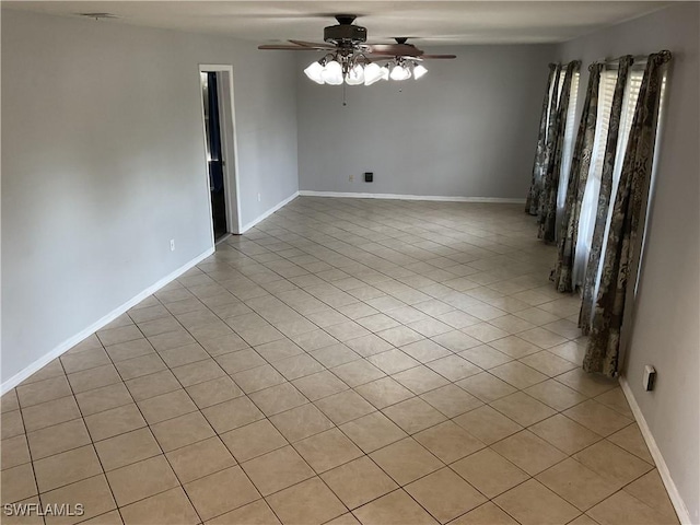 804 Yvonne Ave N, Lehigh Acres, FL 33971 - unfurnished room featuring ceiling fan, light tile patterned floors, and baseboards