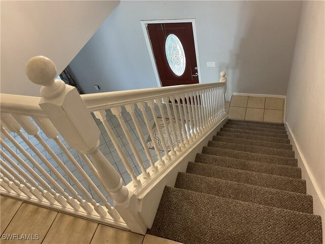 804 Yvonne Ave N, Lehigh Acres, FL 33971 - staircase featuring baseboards