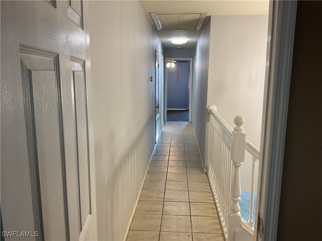 804 Yvonne Ave N, Lehigh Acres, FL 33971 - hallway with attic access, an upstairs landing, and light tile patterned floors