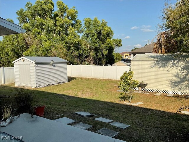 804 Yvonne Ave N, Lehigh Acres, FL 33971 - view of yard with a shed and an outbuilding