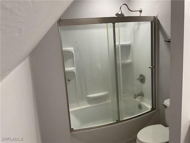 804 Yvonne Ave N, Lehigh Acres, FL 33971 - bathroom featuring toilet and shower / bath combination with glass door