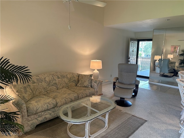 carpeted living room featuring ceiling fan