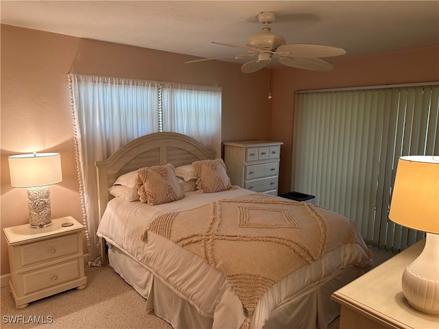 bedroom with ceiling fan and carpet floors