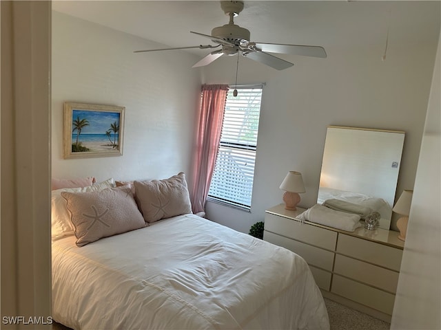 bedroom with ceiling fan and carpet flooring