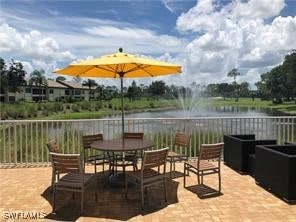 view of patio with a water view