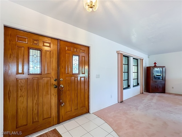 foyer featuring a healthy amount of sunlight and light colored carpet