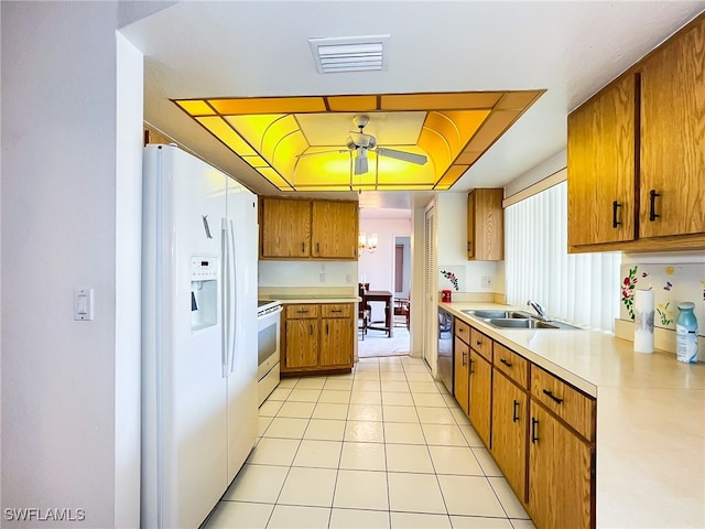 kitchen with sink, light tile patterned flooring, white appliances, and ceiling fan