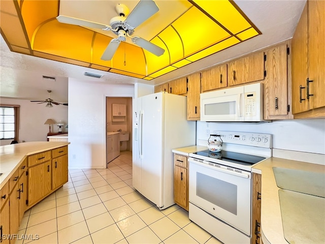 kitchen with white appliances, ceiling fan, and light tile patterned flooring