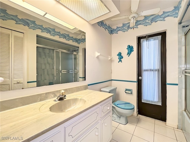 bathroom featuring vanity, ceiling fan, toilet, and tile patterned flooring