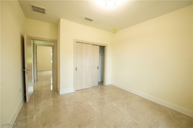 unfurnished bedroom featuring a closet