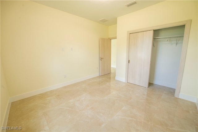 unfurnished bedroom featuring a closet