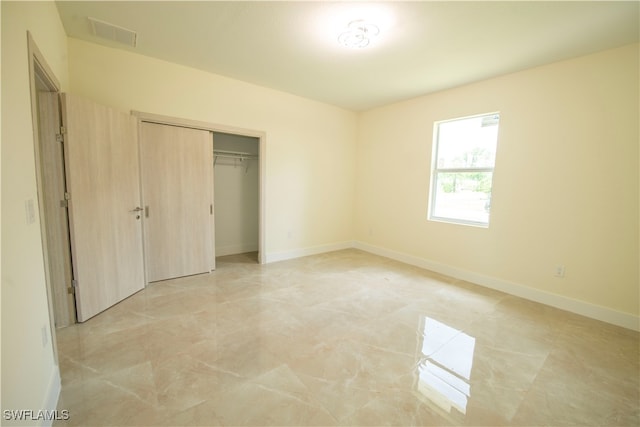 unfurnished bedroom featuring a closet