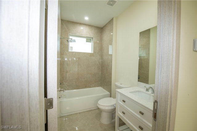 full bathroom featuring vanity, toilet, and tiled shower / bath