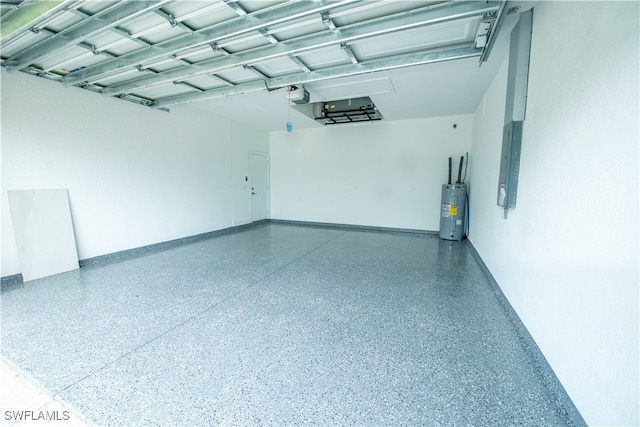 garage with water heater, electric panel, and a garage door opener