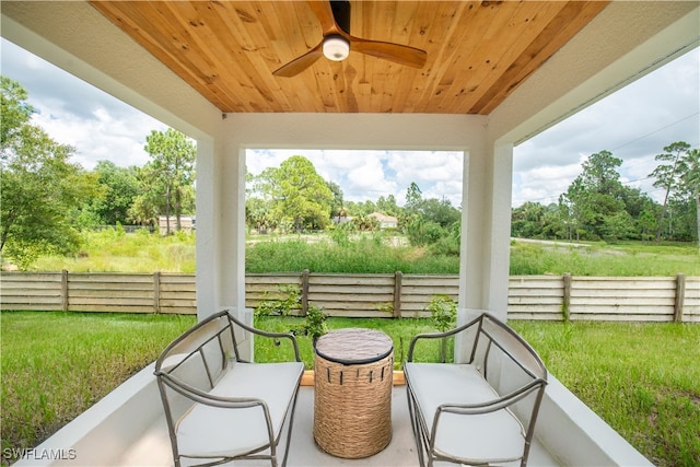 view of patio featuring ceiling fan