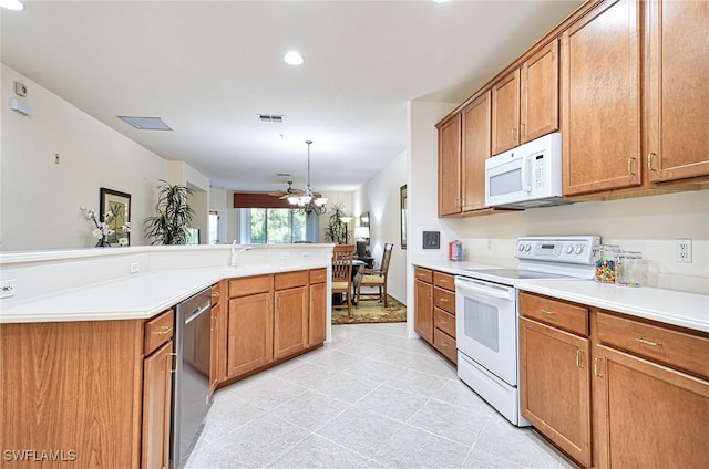 kitchen with decorative light fixtures, white appliances, light tile patterned floors, and ceiling fan