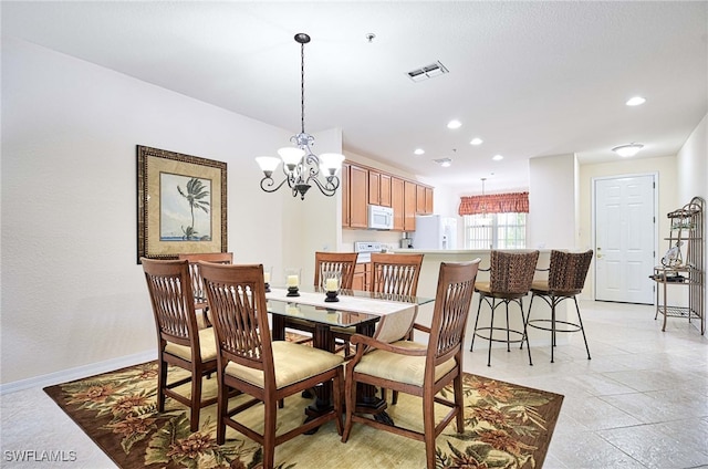 dining area with a chandelier