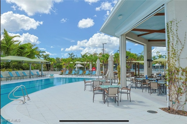 view of swimming pool featuring a patio