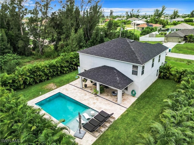 view of swimming pool with a yard and a patio area