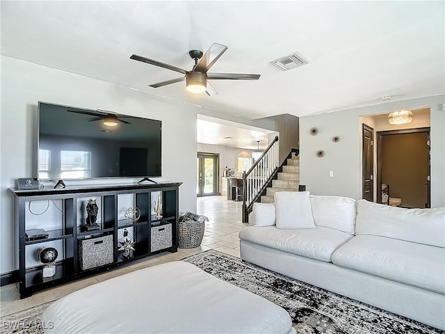 living room featuring ceiling fan and light tile patterned floors