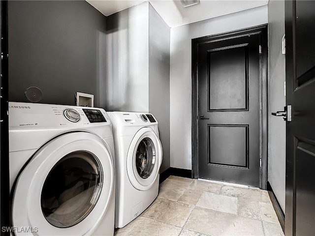 laundry area with separate washer and dryer