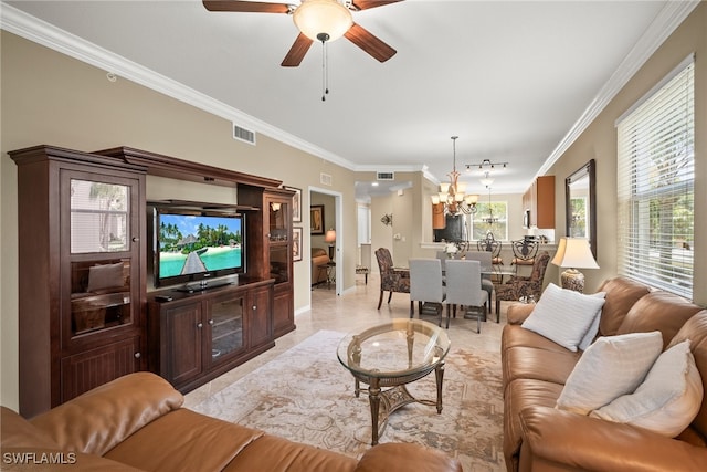 living room featuring crown molding and ceiling fan with notable chandelier