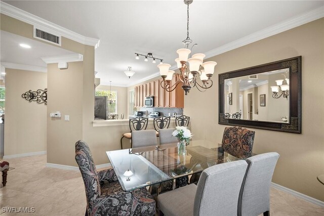 dining space featuring ornamental molding, a notable chandelier, and light tile patterned floors