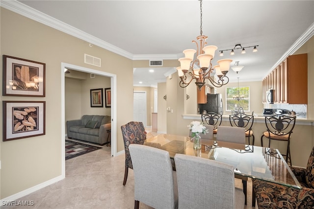 tiled dining room featuring a chandelier and crown molding