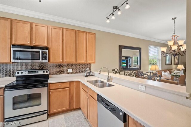 kitchen featuring ornamental molding, a chandelier, sink, decorative backsplash, and appliances with stainless steel finishes