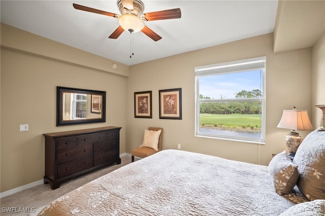 bedroom with ceiling fan and light tile patterned floors