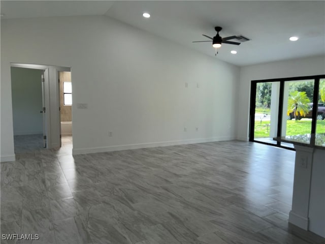 spare room featuring lofted ceiling and ceiling fan