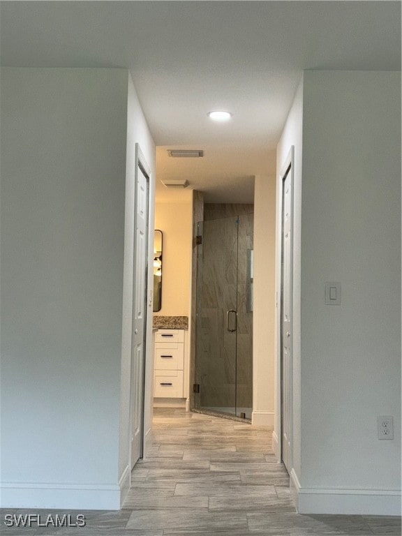 hallway featuring light wood-type flooring