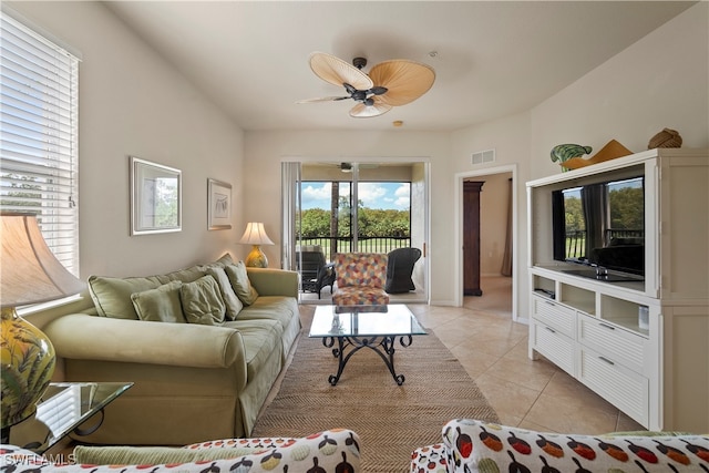 living room with ceiling fan and light tile patterned floors