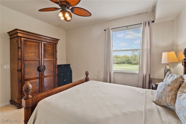 bedroom with ceiling fan and carpet floors