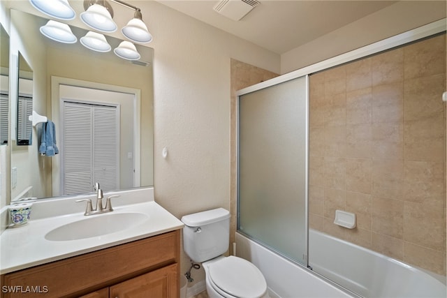 full bathroom with vanity, toilet, and enclosed tub / shower combo