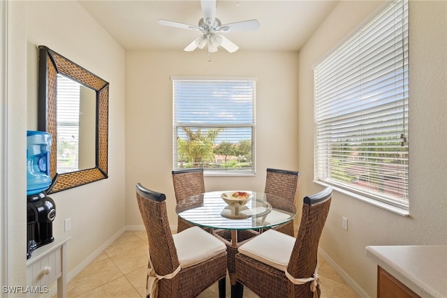 dining area featuring light tile patterned floors and ceiling fan