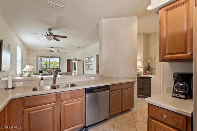 kitchen featuring sink, kitchen peninsula, light tile patterned flooring, ceiling fan, and stainless steel dishwasher