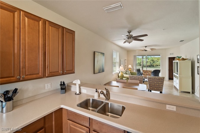 kitchen featuring sink and ceiling fan