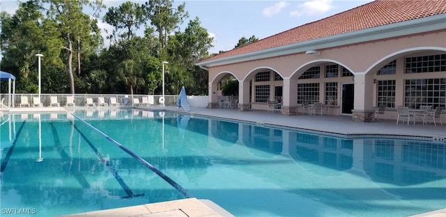 view of swimming pool featuring a patio area