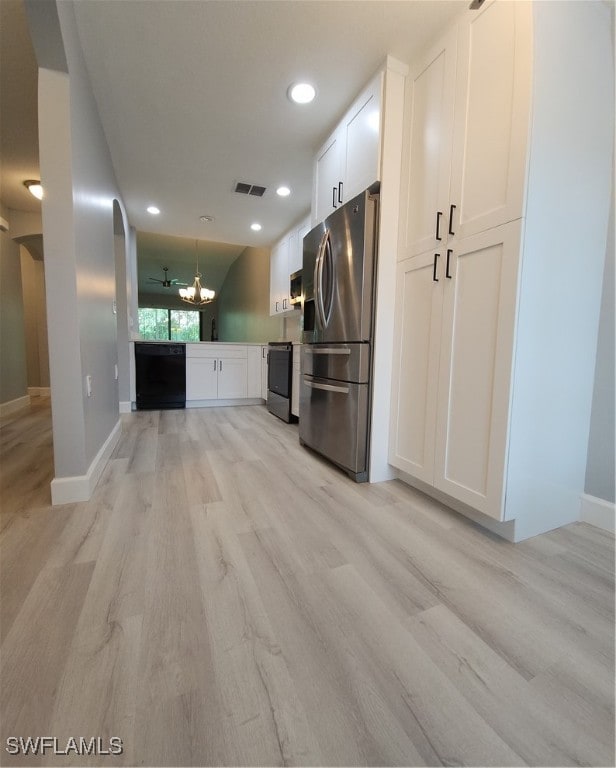 kitchen featuring light wood-type flooring, stainless steel refrigerator with ice dispenser, white cabinetry, and black stove