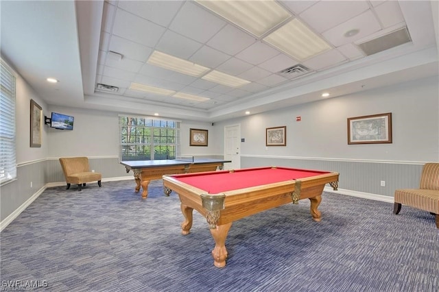 game room with a raised ceiling, dark colored carpet, billiards, and a paneled ceiling